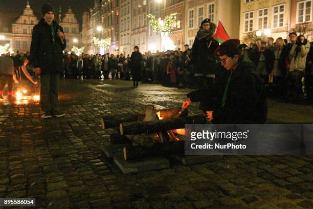 Scouts are seen during the Peace Light of Bethlehem transfer ceremony are seen in Gdansk, Poland on 19 December 2017 The Peace Light of Bethlehem is...