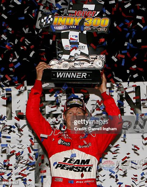 Ryan Briscoe, driver of the Team Penske Dallara Honda celebrates winning the IRL IndyCar Series Meijer Indy 300 on August 1, 2009 at the Kentucky...