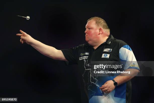 John Henderson of Scotland in action during his first round match against Marko Kantele of Finland on day six of the 2018 William Hill PDC World...