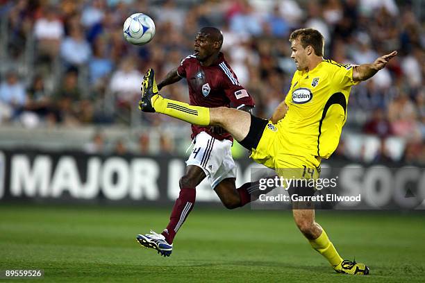 Omar Cummings of the Colorado Rapids fights for the ball against Chad Marshall of the Columbus Crew on August 1, 2009 at Dicks Sporting Goods Park in...