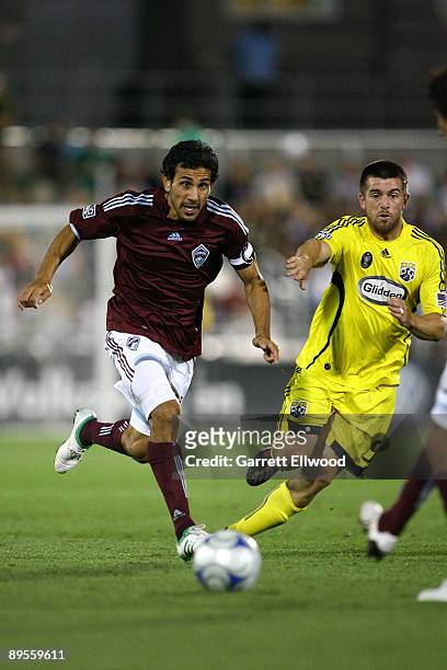 Pablo Mastroeni of the Colorado Rapids controls the ball against Jason Garey of the Columbus Crew on August 1, 2009 at Dicks Sporting Goods Park in...