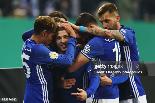 Max Meyer of Schalke 04 celebrates scoring his teams first goal of the game with team mates during the DFB Pokal match between FC Schalke 04 and 1....