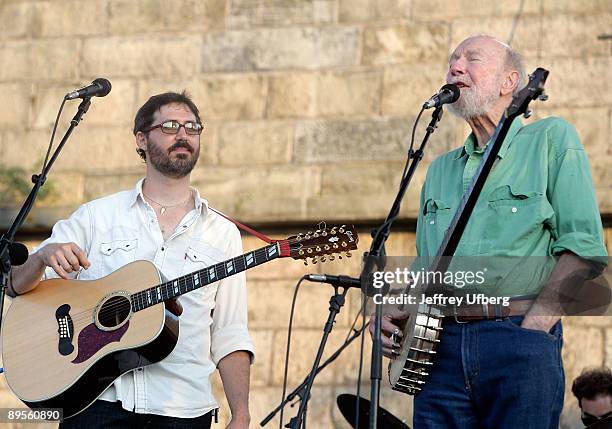 Musicians Tao Rodriquez Seeger and his grandfather Pete Seeger perform during day 1 of the George Wein Folk Festival 50 at Fort Adams State Park on...