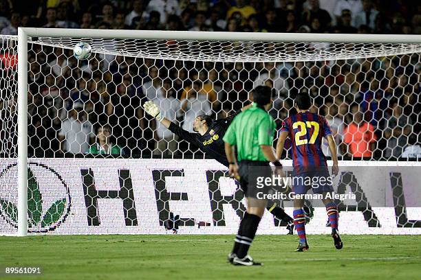 Jose Manuel Pinto GK of FC Barcelona watches as David Beckham's free kick enters his goal during the friendly soccer match at the Rose Bowl on August...