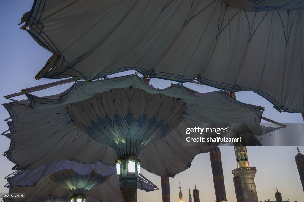 Morning view of minarets and big umbrellas for Nabawi Mosque