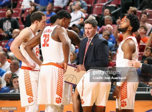 Head coach Brad Brownell of the Clemson Tigers directs the players during a break in action against the Florida Gators during the MetroPCS Orange...