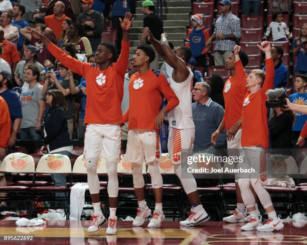 The Clemson Tigers bench celebrates the victory against the Florida Gators during the MetroPCS Orange Bowl Basketball Classic on December 16, 2017 at...