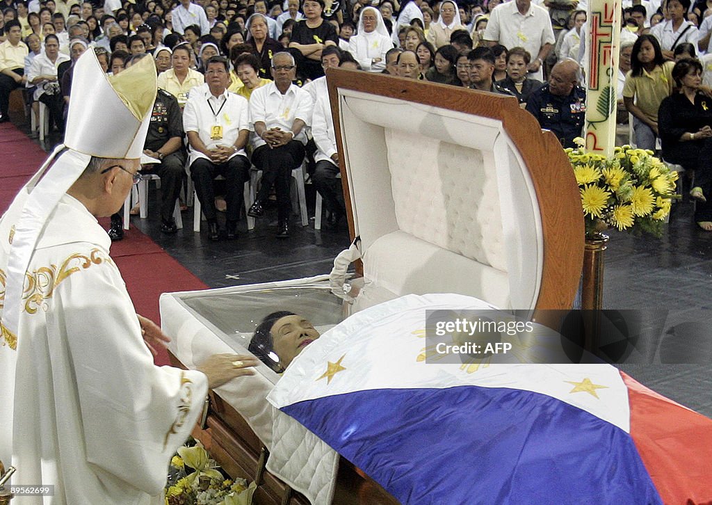Filipino Bishop Angel Lagdameo (L) offer
