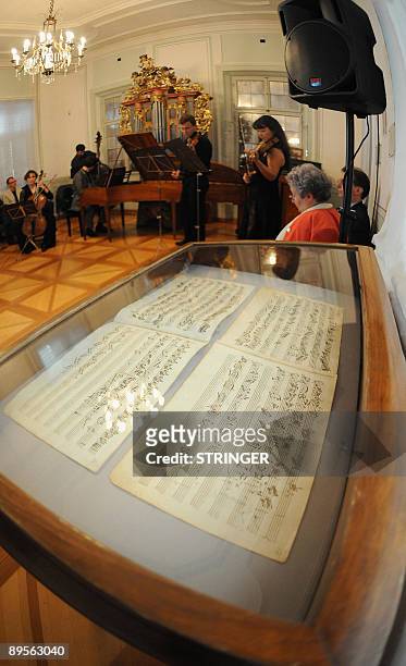Two piano pieces almost certainly composed by Wolfgang Amadeus Mozart are presented on August 2, 2009 as musicians perform during a press conference...