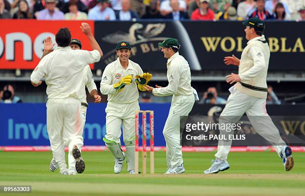 Australian wicket keeper Graham Manou celebrates dismissing England batsman Andrew Strauss on the fourth day of the third Ashes cricket test between...