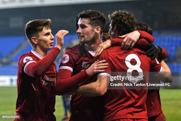 Matty Virtue of Liverpool celebrates his goal with team mates Ben Woodburn and Corey Whelan during the Liverpool v PSV Eindhoven Premier League...