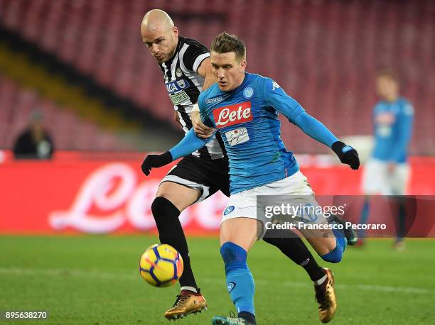 Player of SSC Napoli Piotr Zielinski vies with Udinese Calcio player Bram Nuytinck during the TIM Cup match between SSC Napoli and Udinese Calcio at...