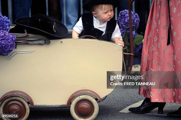 Baby wearing traditionnal clothes is seen on August 2, 2009 in Lorient, western France, during the celtics nations Great Parade of the "festival...