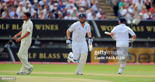 England batsman Andrew Flintoff and Matt Prior add runs off the bowling of Australian Ben Hilfenhaus on the fourth day of the third Ashes cricket...