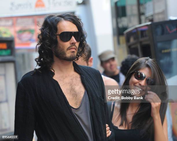 Russell Brand and fan on location for "Get Him To The Greek" in Rockefeller Center on August 1, 2009 in New York, New York.
