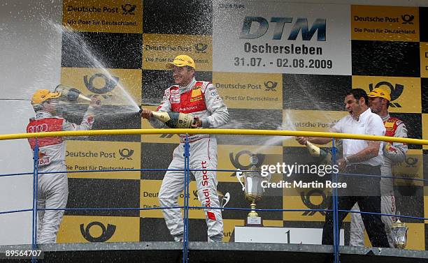 Mattias Ekstroem of Sweden and Red Bull Audi A4 finishing 2nd position, Hans Juergen Abt, team manger of Audi, Timo Scheider of Germany and Audi A4...