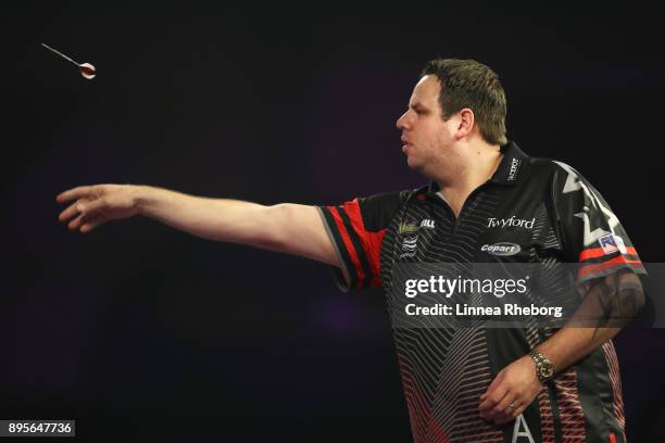 Adrian Lewis of England in action during his first round match against Kevin Münch of Germany on day six of the 2018 William Hill PDC World Darts...