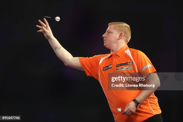 Richard North of England in action during his first round match against Raymond van Barneveld of Netherlands on day six of the 2018 William Hill PDC...