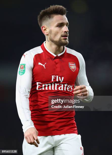 Mathieu Debuchy of Arsenal looks on during the Carabao Cup Quarter Finals match between Arsenal and West Ham United at Emirates Stadium on December...