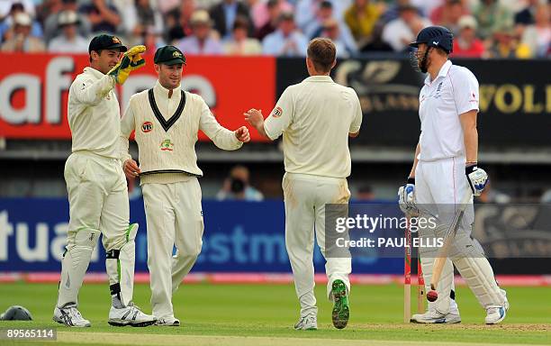 England batsman Andrew Flintoff turns after being caught out off the bowling of Australian bowler Nathan Hauritz on the fourth day of the third Ashes...