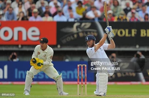 England batsman Andrew Flintoff hits a four past Australian wicket keeper Graham Manou on the fourth day of the third Ashes cricket test between...