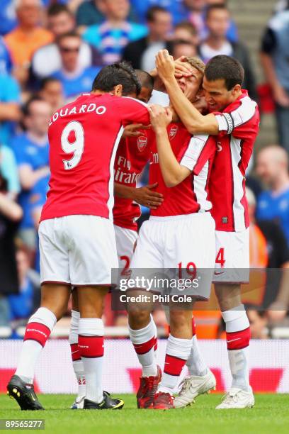 Jack Wilshere of Arsenal is congratulated by teammates after scoring the opening goal during the Emirates Cup match between Arsenal and Glasgow...