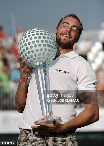 Oskar Henningsson od Sweden poses with his trophy as he celebrates his victory in the European PGA Moravia Silesia Open golf tournament in Celadna on...