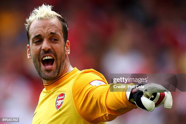 Manuel Almunia of Arsenal directs his defence during the Emirates Cup match between Arsenal and Glasgow Rangers at the Emirates Stadium on August 2,...