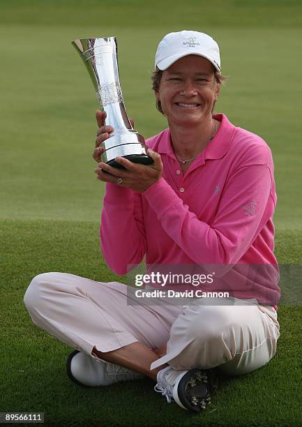 Catriona Matthew of Scotland holds the trophy aloft following her victory at the end of the final round of the 2009 Ricoh Women's British Open...