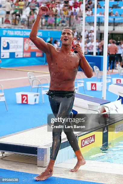 Oussama Mellouli of Tunisia celebrates victory in the Men's 1500m Freestyle Final during the 13th FINA World Championships at the Stadio del Nuoto on...