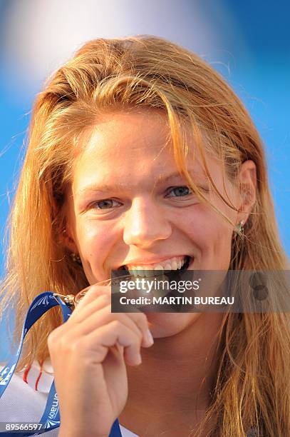 Russia's Yuliya Efimova celebrates on the podium of the women's 50m breaststoke final on August 2, 2009 at the FINA World Swimming Championships in...