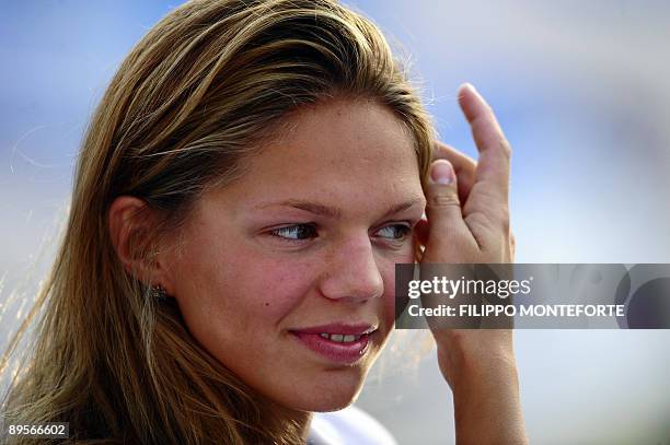 Gold medalist Russia's Yuliya Efimova celebrates on the podium of the women's 50m breaststoke final on August 2, 2009 at the FINA World Swimming...