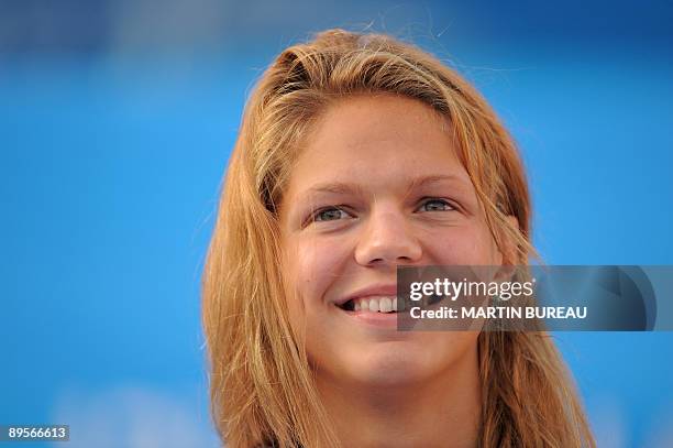 Russia's Yuliya Efimova celebrates on the podium of the women's 50m breaststoke final on August 2, 2009 at the FINA World Swimming Championships in...