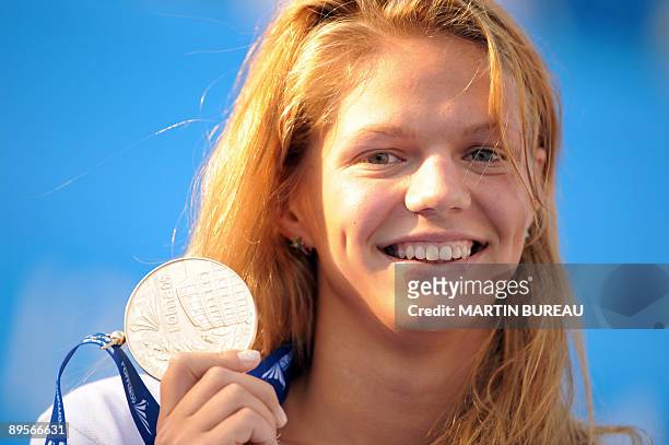 Russia's Yuliya Efimova celebrates on the podium of the women's 50m breaststoke final on August 2, 2009 at the FINA World Swimming Championships in...