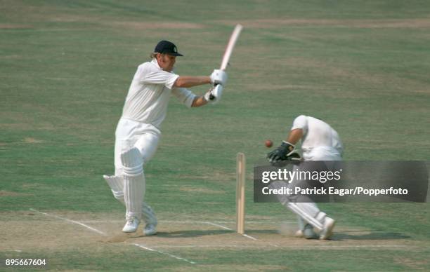 Australia's wicketkeeper Rod Marsh ducks to avoid a shot from England captain Tony Greig during the 2nd Test match between England and Australia at...