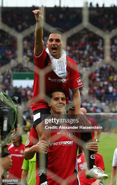 Marcel Gerstle of Neckarelz celebrates with his team mate Jonas Zimmermann after the DFB Cup first round match between SpVgg Neckarelz and FC Bayern...