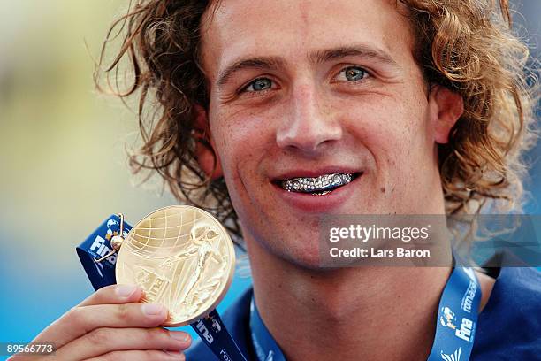 Ryan Lochte of the United States receives the gold medal during the medal ceremony for the Men's 400m Individual Medley Final during the 13th FINA...