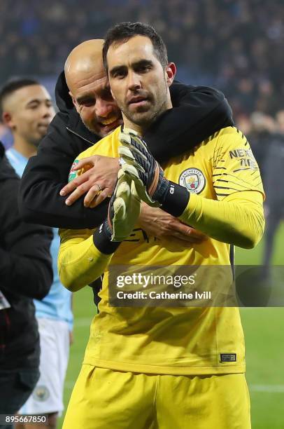 Claudio Bravo of Manchester City and Josep Guardiola, Manager of Manchester City celebrate penalty shoot out victory after the Carabao Cup...