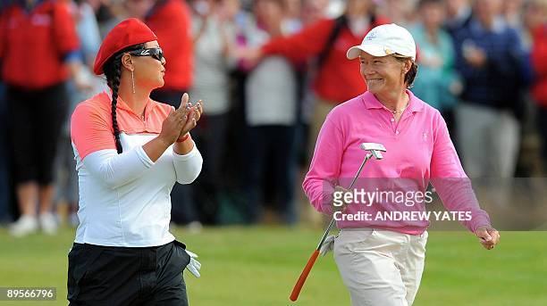 Catriona Matthew of Britain walks to the 18th green with playing partner Christina Kim of the US during the Womens British open golf championship...