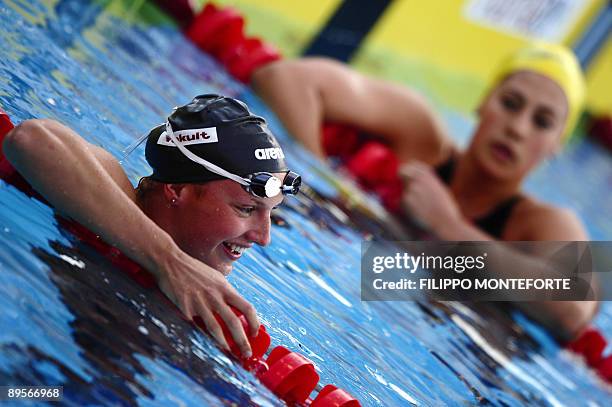 Hungary's Katinka Hosszu reacts near Australia's Stephanie Rice after the women's 400m individual medley final on August 2, 2009 at the FINA World...