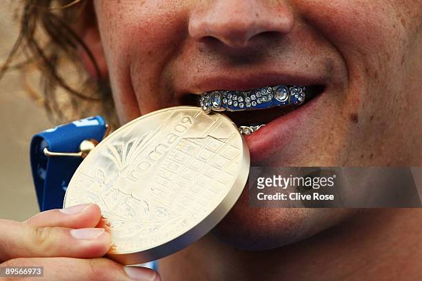 Ryan Lochte of the United States receives the gold medal during the medal ceremony for the Men's 400m Individual Medley Final during the 13th FINA...