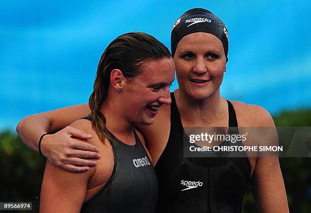 Hungary's Katinka Hosszu is congratulated by Zimbabwe's Kirsty Coventry after the women's 400m individual medley final on August 2, 2009 at the FINA...