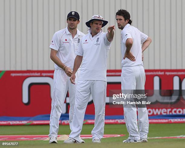 Andrew Strauss of England sets his field with team mates James Anderson and Graham Onions looking on during day four of the npower 3rd Ashes Test...