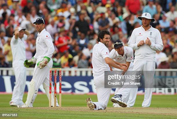 Graham Onions of England smiles with team mates after failing to take a catch off his own bowling during day four of the npower 3rd Ashes Test Match...