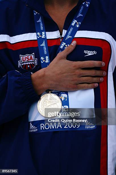 Michael Phelps of the United States receives the gold medal during the medal ceremony for the Men's 4x 100m Medley Relay Final during the 13th FINA...