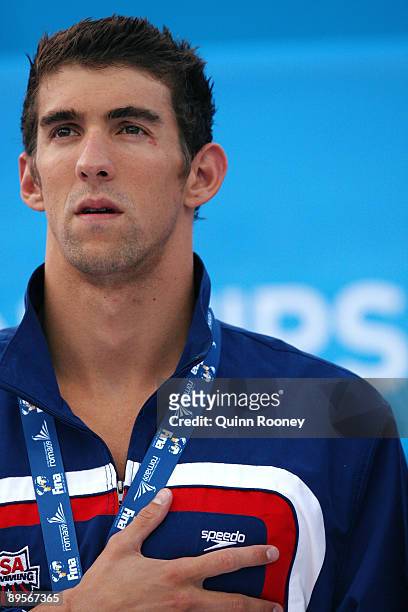 Michael Phelps of the United States receives the gold medal during the medal ceremony for the Men's 4x 100m Medley Relay Final during the 13th FINA...