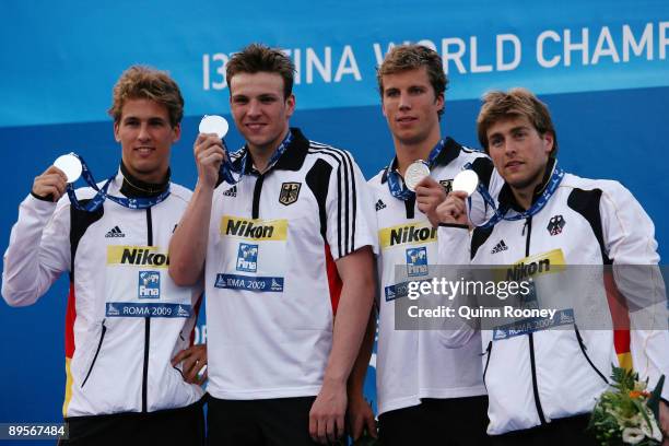 Helge Meeuw , Hendrik Feldwehr , Benjamin Starke and Paul Biedermann of Germany receive the silver medal during the medal ceremony for the Men's 4x...