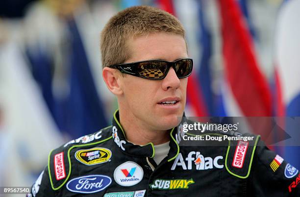 Carl Edwards, driver of the Aflac Ford, stands on pit road prior to the NASCAR Sprint Cup Series Sunoco Red Cross Pennsylvania 500 at the Pocono...