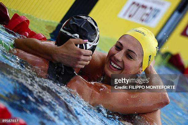 Australia's silver medalist Stephanie Rice congratulates Hungary's gold medalist Katinka Hosszu after the women's 400m individual medley final on...