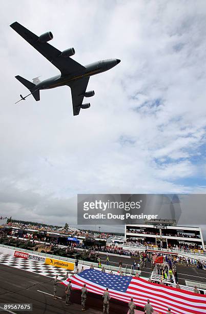 Stratotanker air refueling tanker flies over during the National Anthem prior to the start of the NASCAR Sprint Cup Series Sunoco Red Cross...
